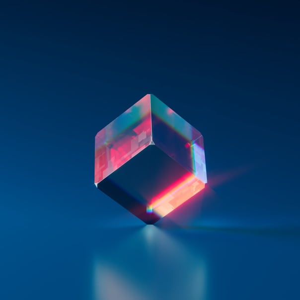 lit glass cube standing on corner